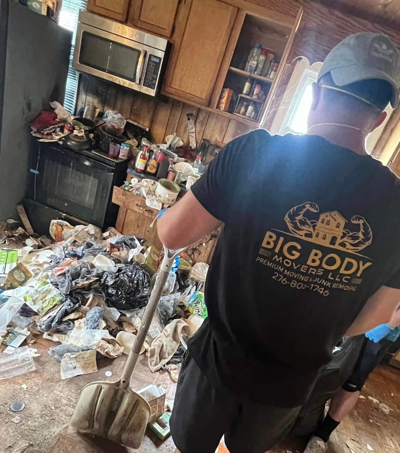 Employee of Big Body Movers doing hoarding cleanouts for customer.